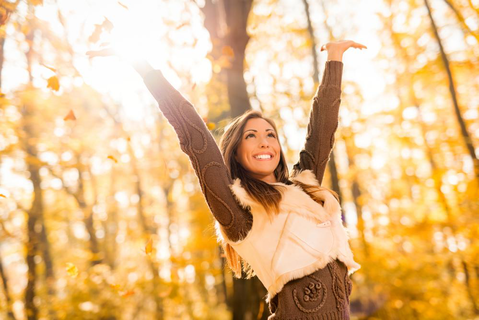 A young woman with glowing skin enjoying the autumn sunPicture